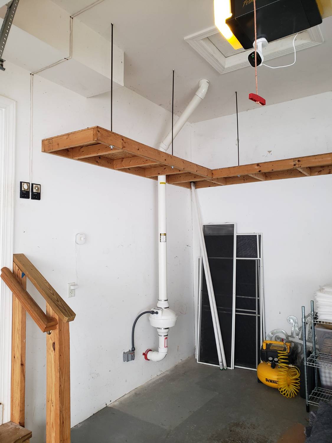Radon mitigation system in a basement garage installation