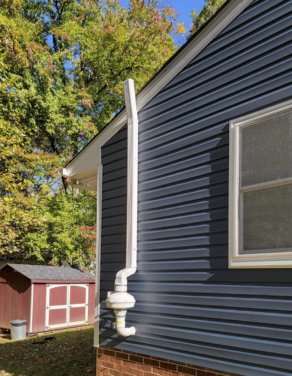 Radon services on residential home exterior
