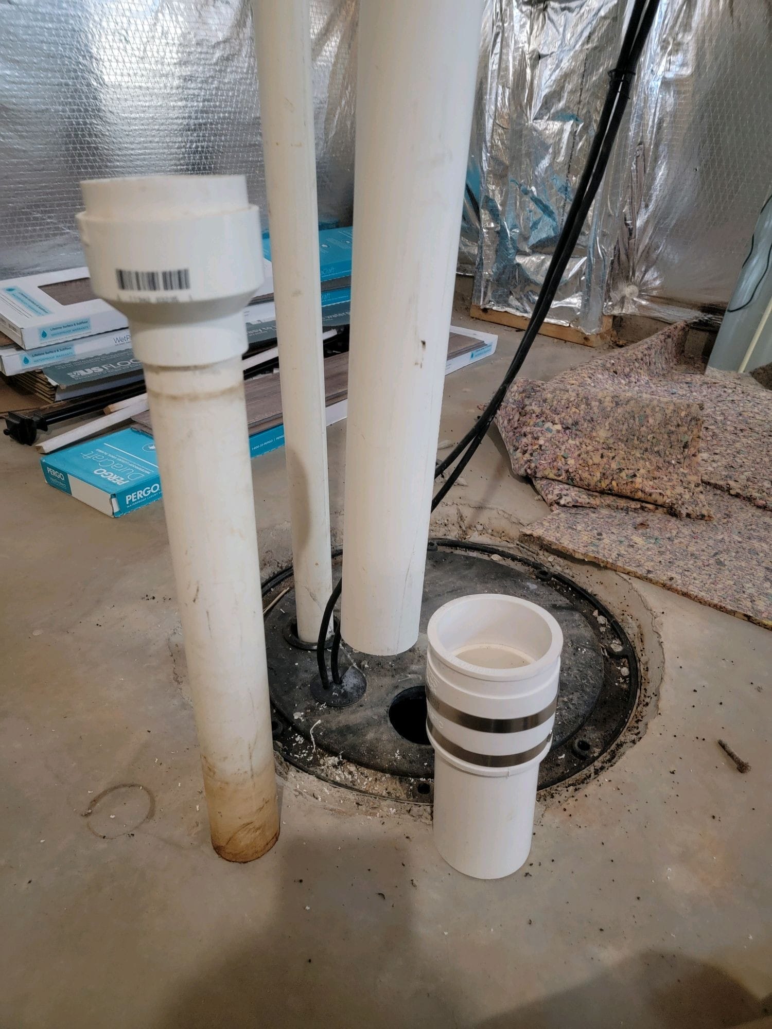 Radon system repair components and piping in basement
