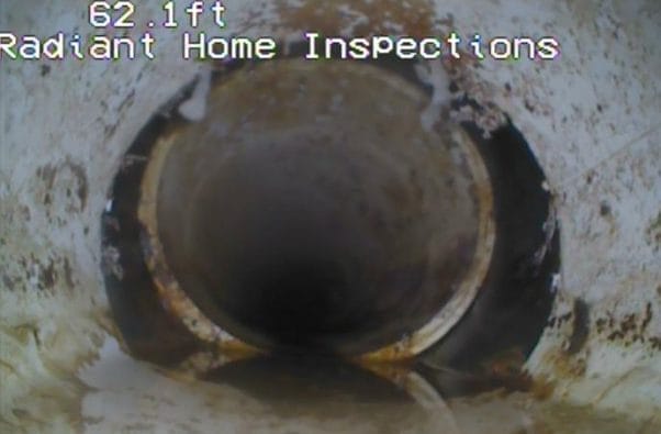 Sewer pipe interior inspection by Radiant Home Inspections at 62.1ft
