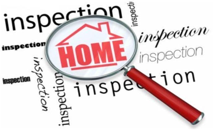 Magnifying Glass Over the Word Home and Inspection
